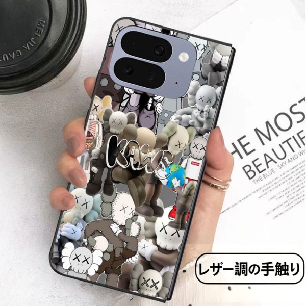 Kaws カウズかわいいGalaxy Z flip Fold 5 4 6 7 8ケース 耐衝撃レザー グーグル ピクセルPro 11 10 9 foldスマホケース 携帯カバー iPhone ultra fold 2026スマホケース気質オシャレ Galaxy z fold5 4 6 7 8ブランドスマホケース 