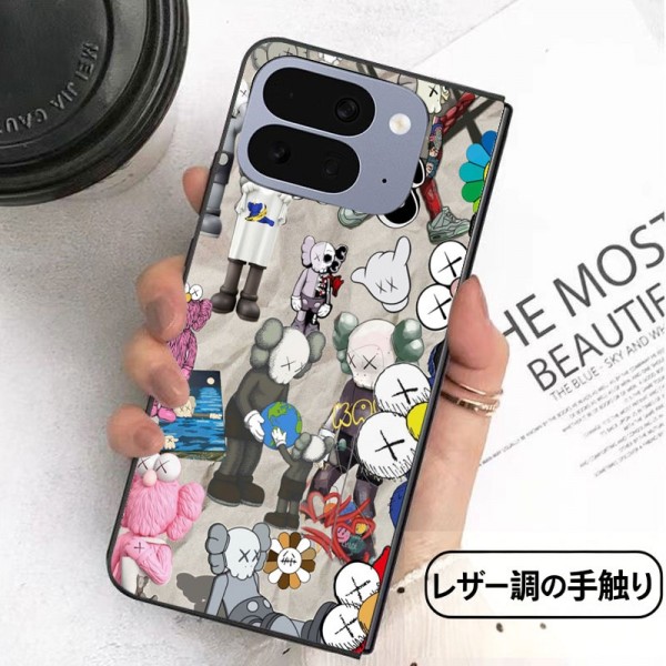 Kaws カウズかわいいGalaxy Z flip Fold 5 4 6 7 8ケース 耐衝撃レザー グーグル ピクセルPro 11 10 9 foldスマホケース 携帯カバー iPhone ultra fold 2026スマホケース気質オシャレ Galaxy z fold5 4 6 7 8ブランドスマホケース 