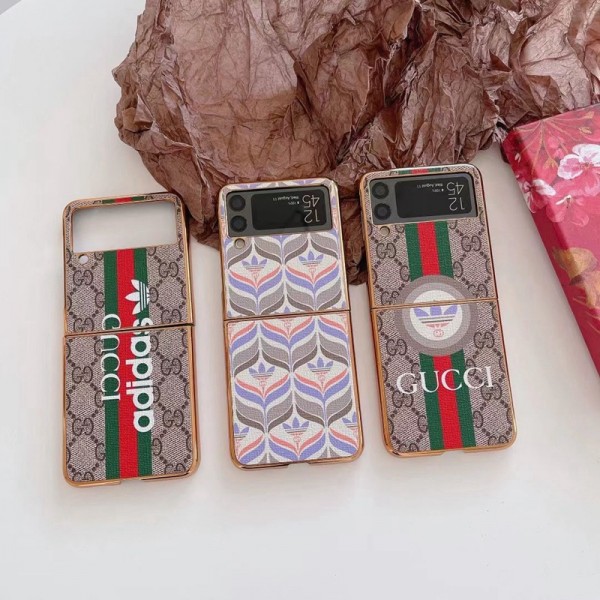 Gucci ギャラクシーz flip5/4スマホケース 精緻カバー グッチ コラボ アディダス galaxy z flip4携帯カバー スタイリッシュ Galaxy z flip4ケース ブランド 耐衝撃 samsung z flip3カバー 放熱性よい